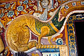 Mulkirigala cave temples - Third terrace. The entrance to the Aluth Viharaya cave. Dragon Arch decorations.