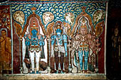 Mulkirigala cave temples - The first cave of the first terrace. Paintings of Vishnu, Kataragama, the demonic blue Vibhishana.