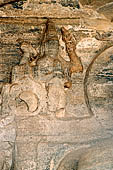 Polonnaruwa - Gal Vihara. The small seated Buddha (x century), details of the reliefs in the background at the sides of the main figure. 