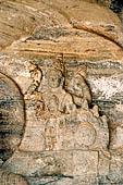 Polonnaruwa - Gal Vihara. The small seated Buddha (x century), details of the reliefs in the background at the sides of the main figure. 