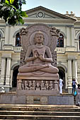 Kandy - Temple of the Sacred Tooth Relic. Buddha statue at the entrance of the Museum of Buddhism. 