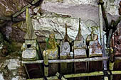Londa - Burial places, coffins suspended on wooden beams 