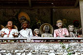 Londa - The entrance to the cave is guarded by a balcony of tau tau. 