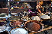 The market of Makale - stalls selling local produce including coffee, tobacco, buckets of live eels, piles of fresh and dried fish, and jugs of  'balok'