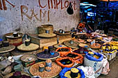 The market of Makale - stalls selling local produce including coffee, tobacco, buckets of live eels, piles of fresh and dried fish, and jugs of  'balok'