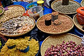 The market of Makale - stalls selling local produce including coffee, tobacco, buckets of live eels, piles of fresh and dried fish, and jugs of  'balok' 
