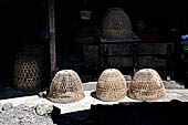 The market of Makale - stalls selling local produce including coffee, tobacco, buckets of live eels, piles of fresh and dried fish, and jugs of  'balok' 