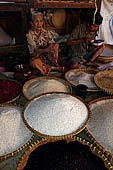 The market of Makale - stalls selling local produce including coffee, tobacco, buckets of live eels, piles of fresh and dried fish, and jugs of  'balok' 