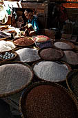 The market of Makale - stalls selling local produce including coffee, tobacco, buckets of live eels, piles of fresh and dried fish, and jugs of  'balok' 