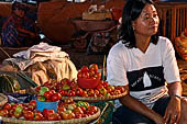 The market of Makale - stalls selling local produce including coffee, tobacco, buckets of live eels, piles of fresh and dried fish, and jugs of  'balok' 