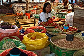 The market of Makale - stalls selling local produce including coffee, tobacco, buckets of live eels, piles of fresh and dried fish, and jugs of  'balok' 