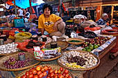 The market of Makale - stalls selling local produce including coffee, tobacco, buckets of live eels, piles of fresh and dried fish, and jugs of  'balok' 