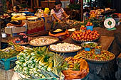 The market of Makale - stalls selling local produce including coffee, tobacco, buckets of live eels, piles of fresh and dried fish, and jugs of  'balok' 
