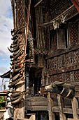 Pallawa - Traditional tongkonan house. The front of the house usually has a carved buffalo head and a collection of genuine buffalo horns.