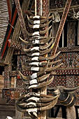 Pallawa - Traditional tongkonan house. The front of the house usually has a carved buffalo head and a collection of genuine buffalo horns.