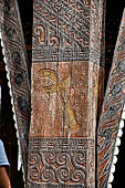Pallawa - Traditional tongkonan house. The exterior walls are covered with wood panels etched with geometric patterns and painted with black and red colours. 
