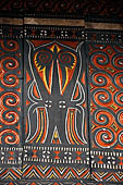 Pallawa - Traditional tongkonan house. The exterior walls are covered with wood panels etched with geometric patterns and painted with black and red colours.  