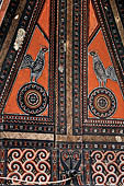 Pallawa - Traditional tongkonan house. The exterior walls are covered with wood panels etched with geometric patterns and painted with black and red colours.  