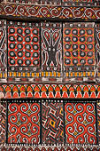 Pallawa - Traditional tongkonan house. The exterior walls are covered with wood panels etched with geometric patterns and painted with black and red colours.  